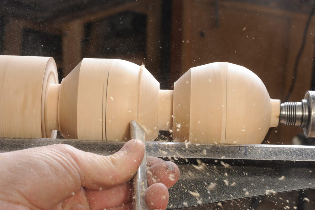 Woodturning process with lathe and chisel