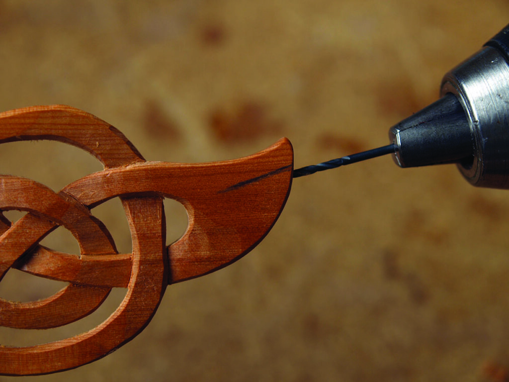 Drilling intricate wooden carving detail