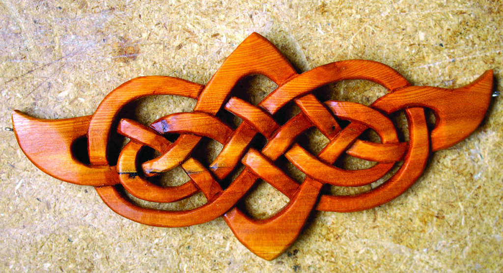 Intricate wooden Celtic knot carving