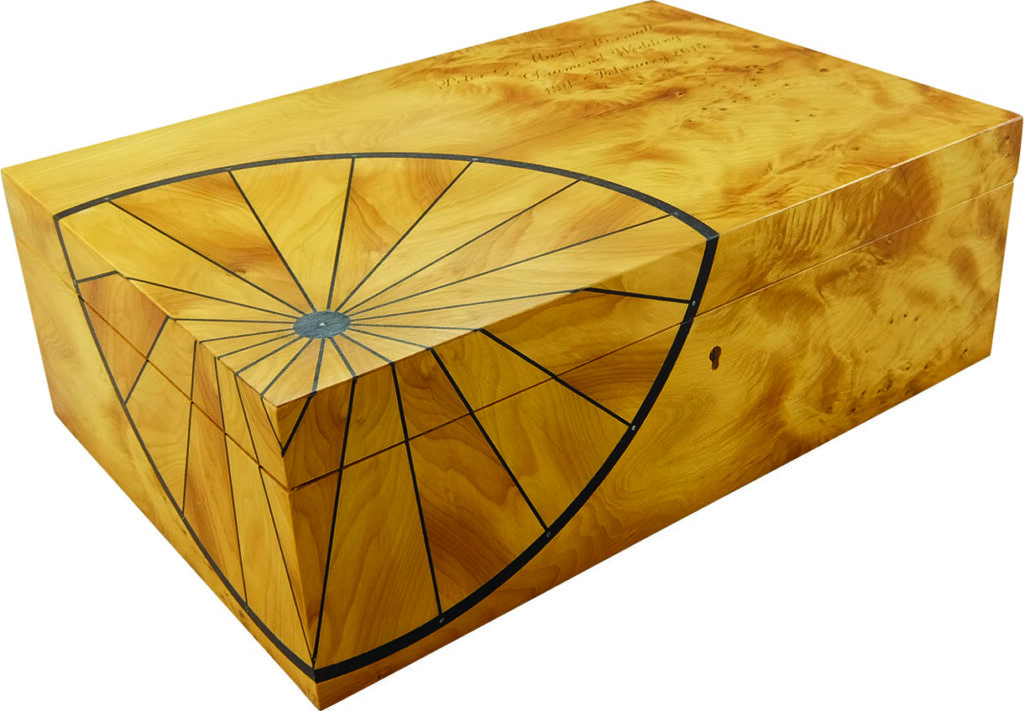 Wooden box with geometric design art.