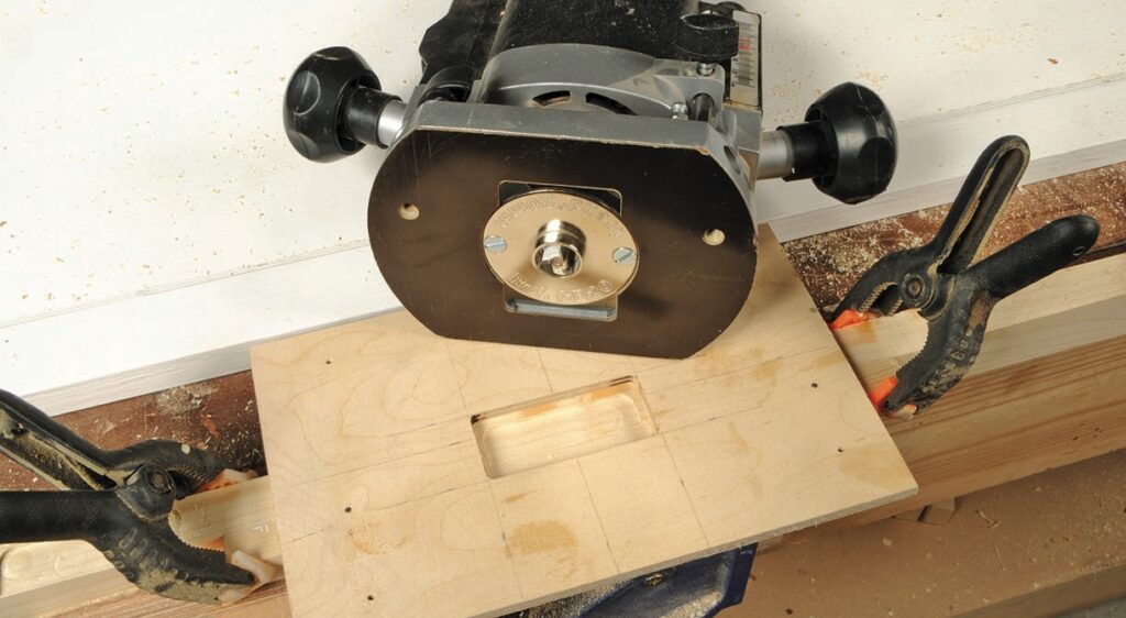 Woodworking router creating a precise slot.