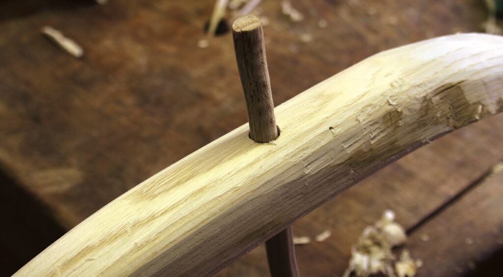 Wooden wheel spoke construction on workbench