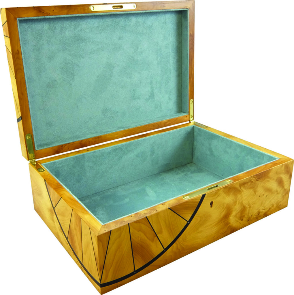Open wooden jewellery box with blue velvet interior.