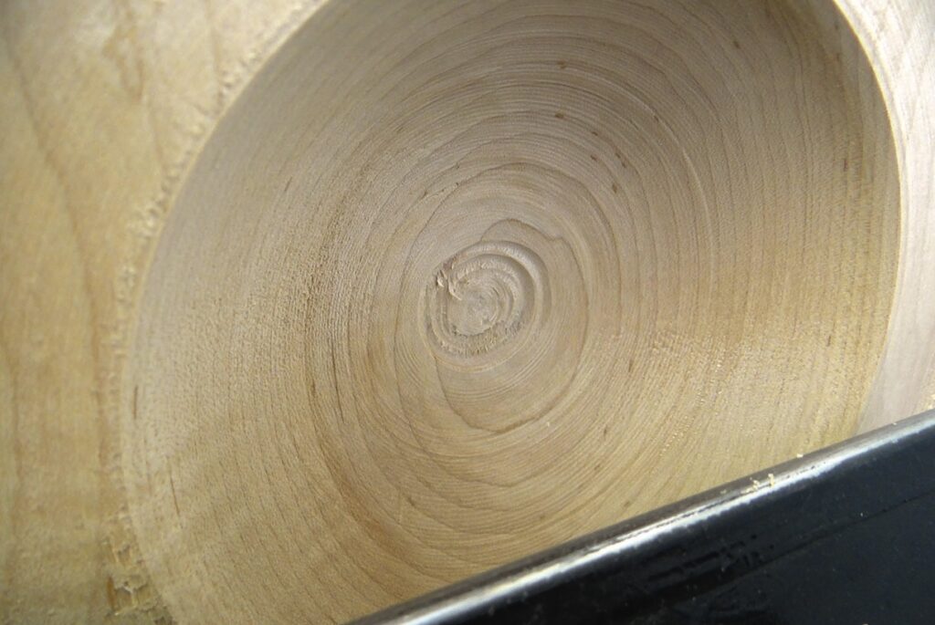Close-up of lathe-turned wooden bowl interior