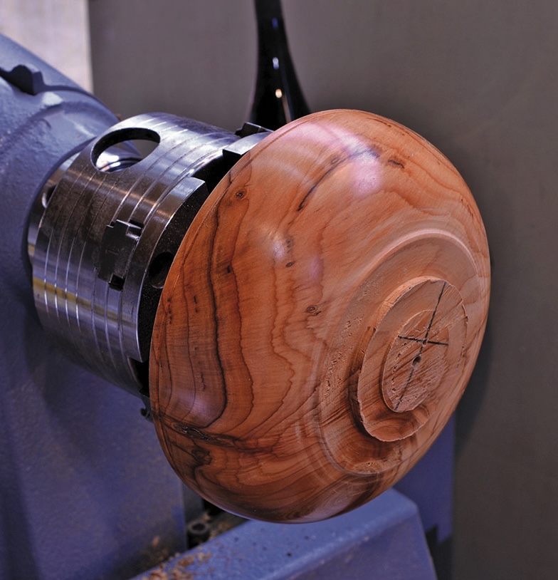 Wooden bowl on a turning lathe.