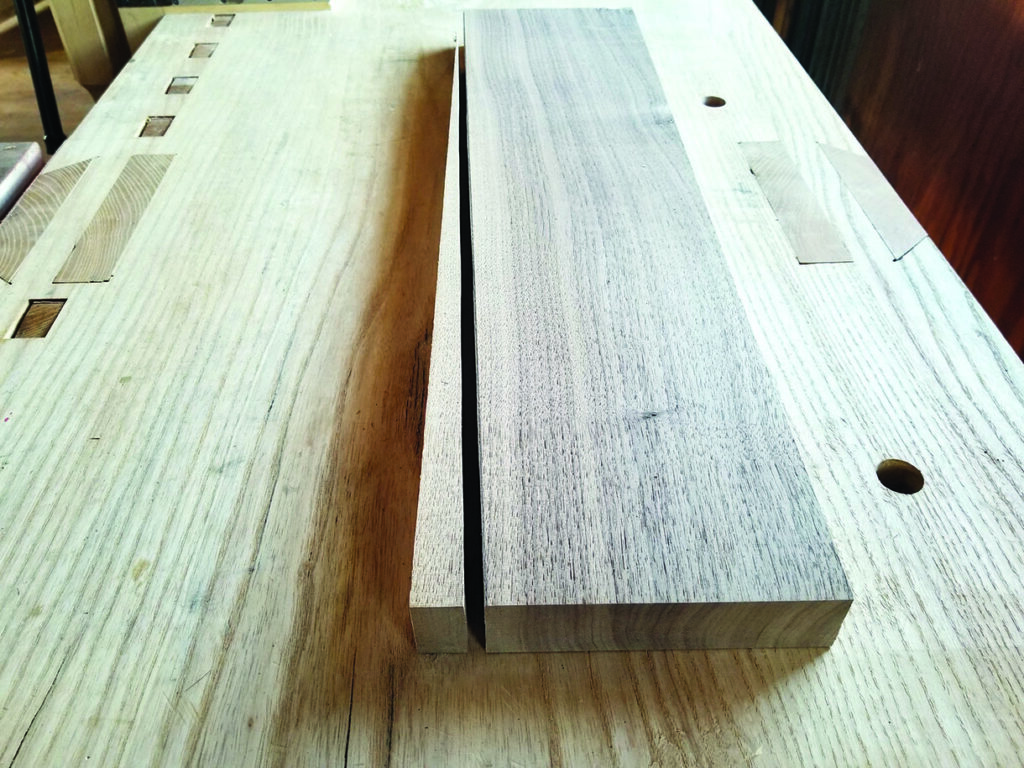 Two wooden planks on a workbench.
