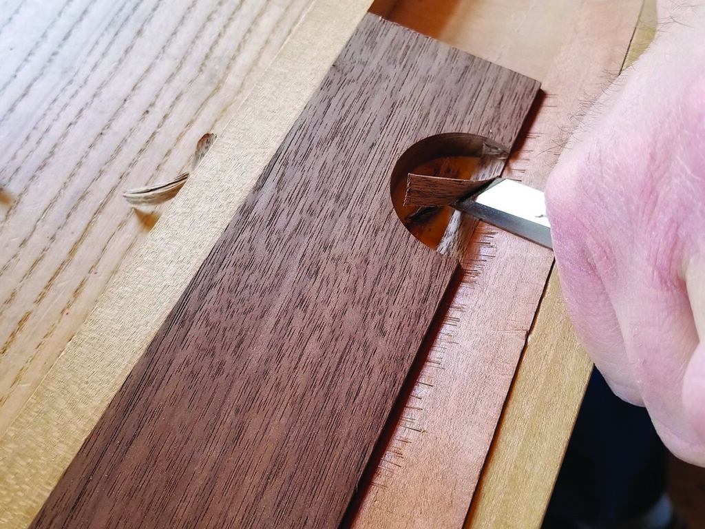 Carving wood with a chisel