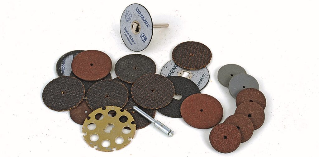 Various Dremel sanding and cutting discs on display.