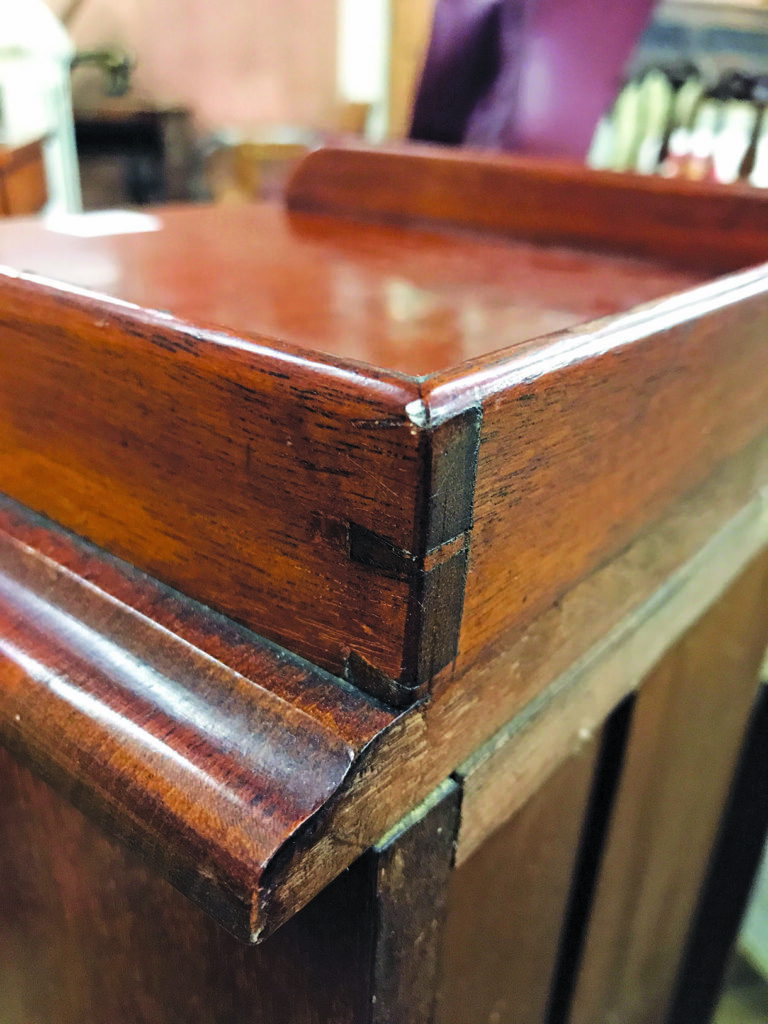 Close-up of antique wooden furniture corner joint