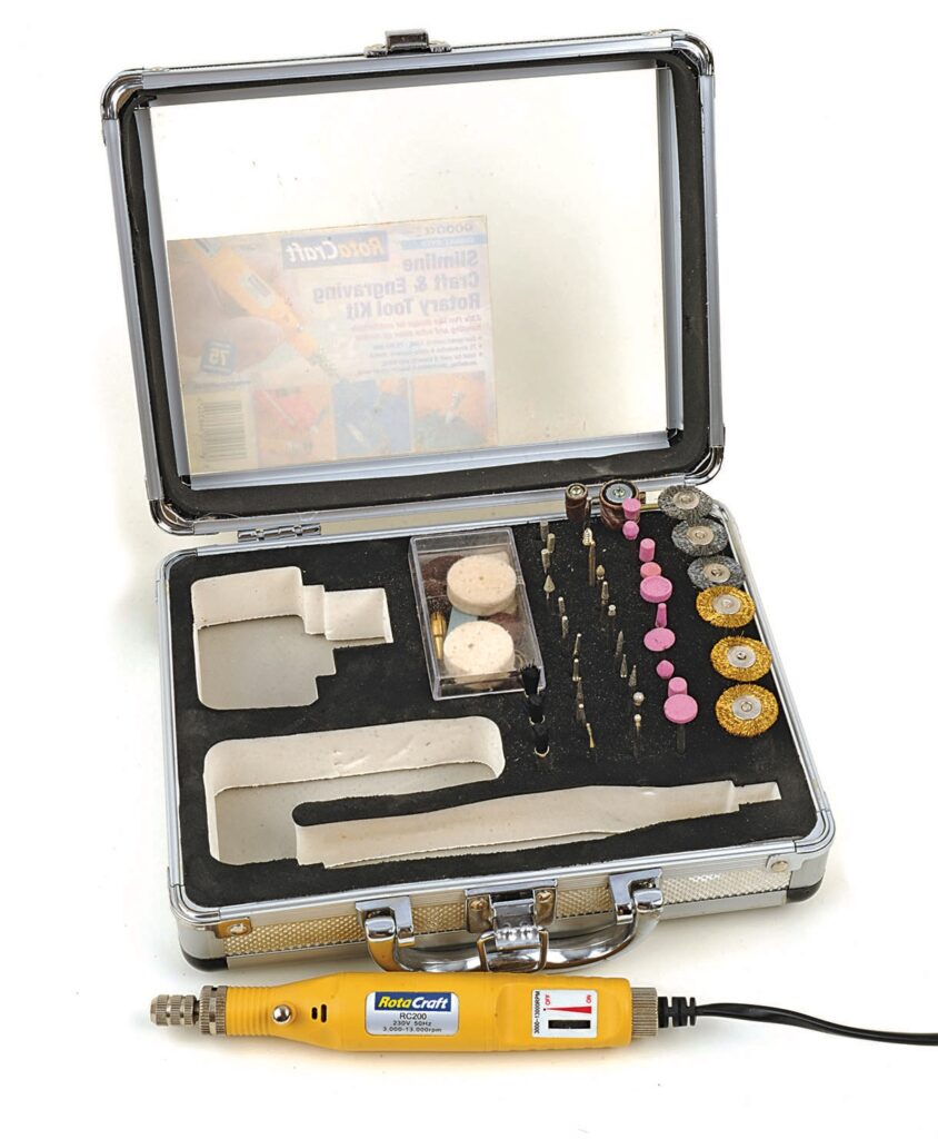 Rotary tool kit with accessories in metal case.