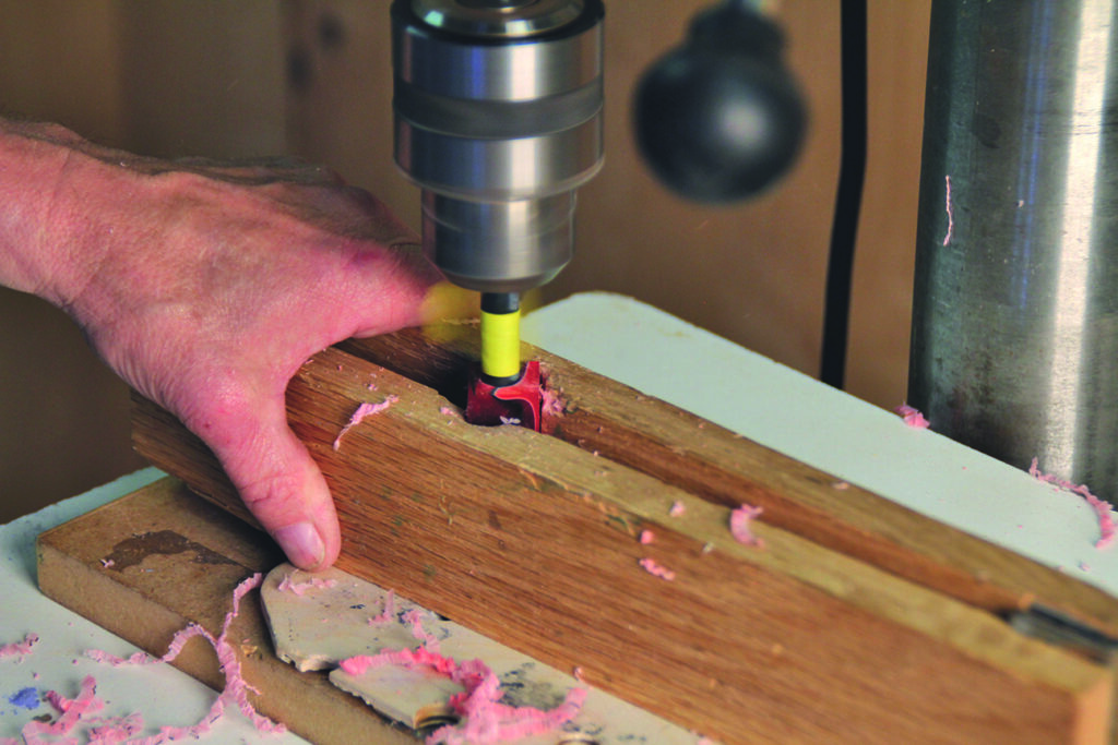Drilling wood with power tool.