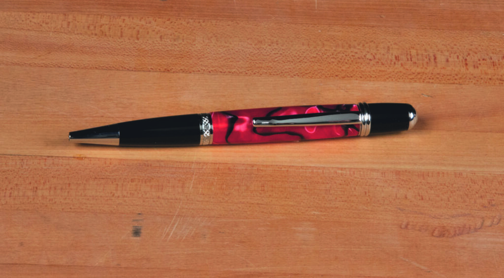 Colourful pen on wooden surface