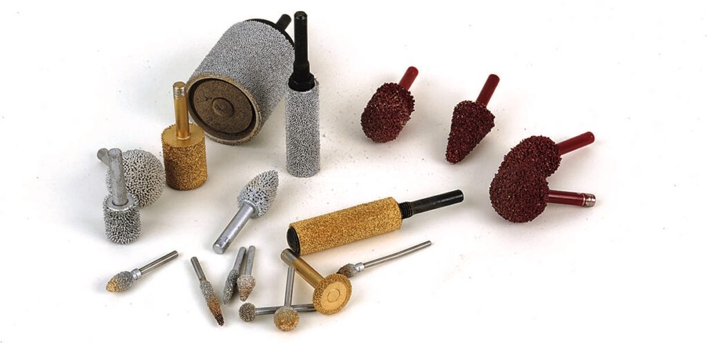 Assorted abrasive grinding bits for rotary tools.
