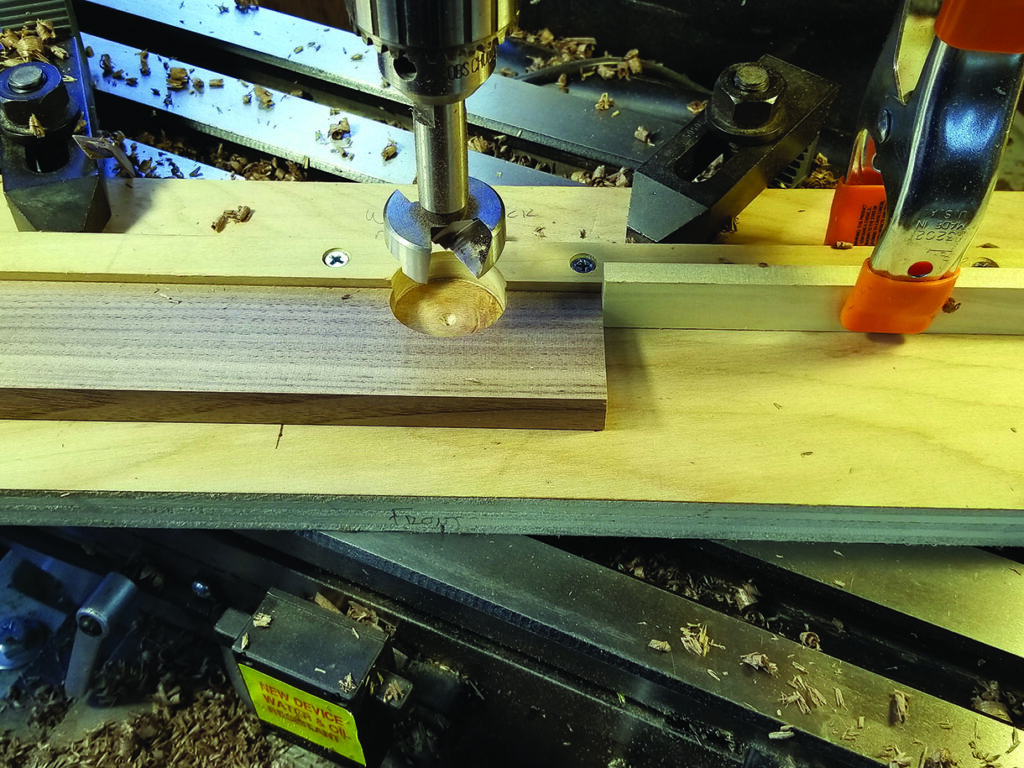 Woodworking drill making precise hole in wood