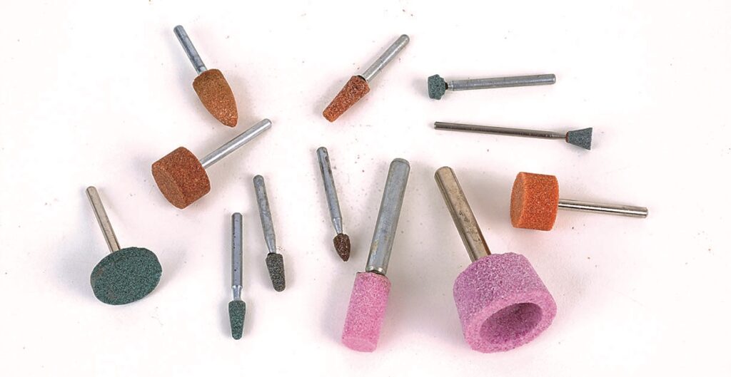 Set of abrasive rotary tools on white background