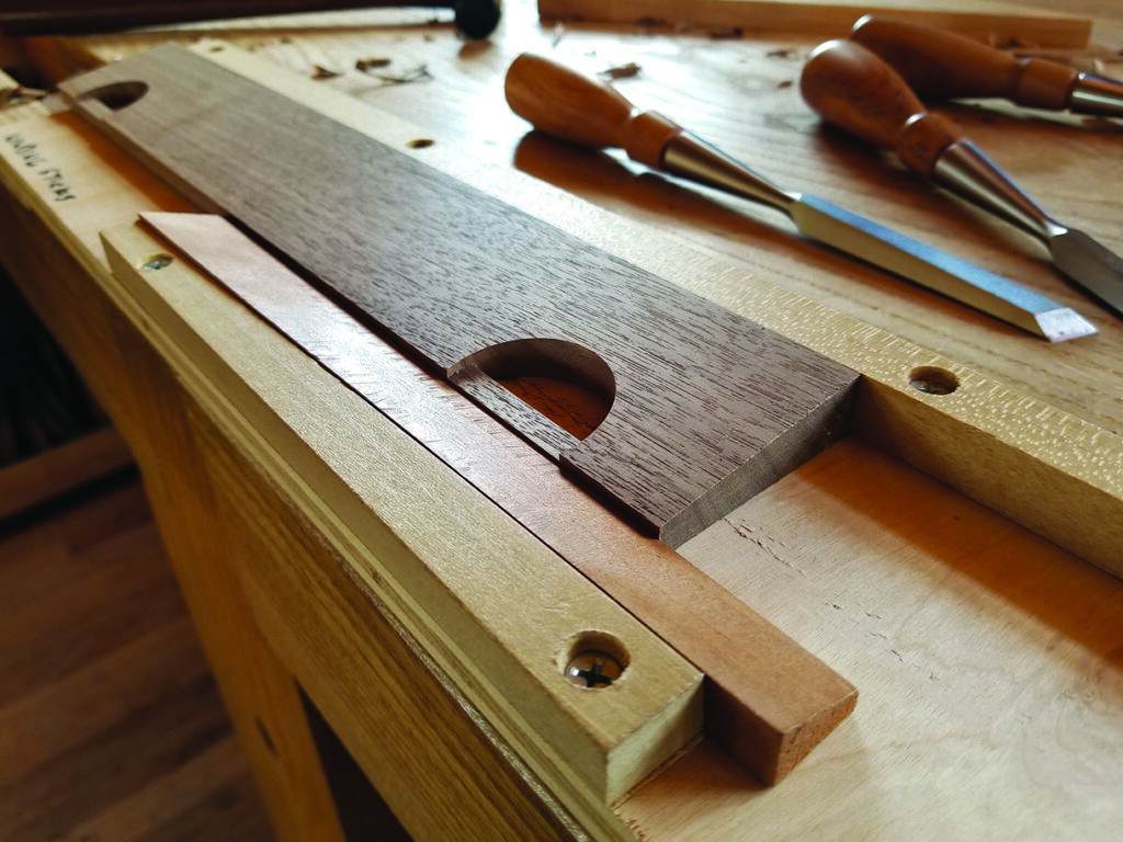 Woodworking tools and materials on a workbench