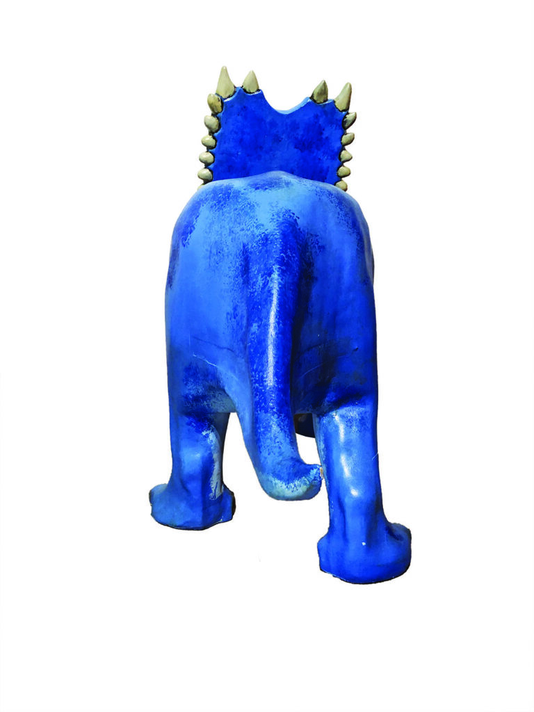Blue dinosaur sculpture with spiked back
