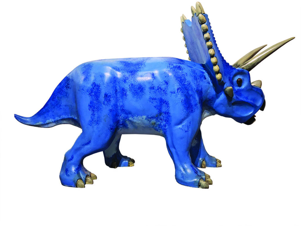 Blue triceratops sculpture with horns and frill.
