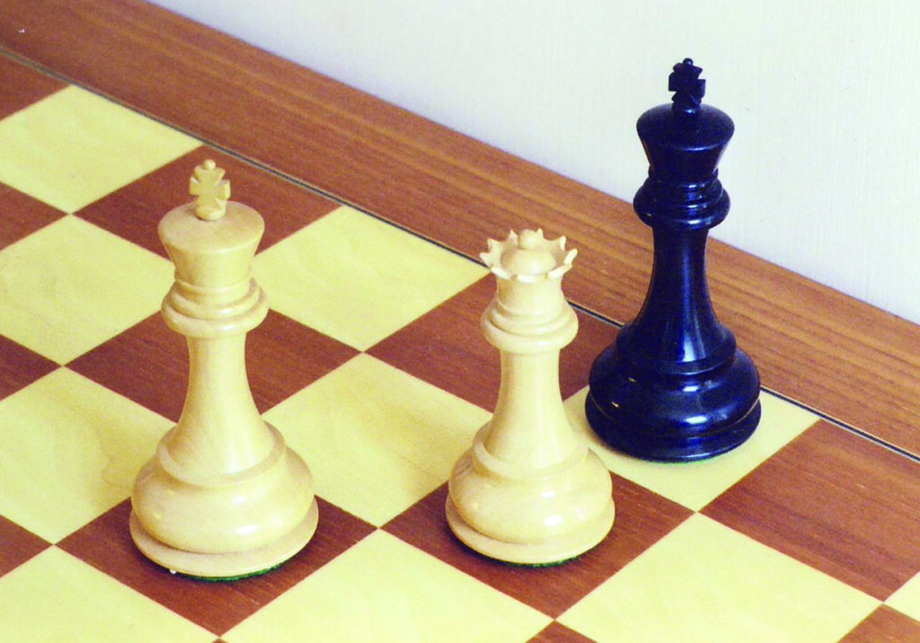 Chess checkmate with king and queen pieces.