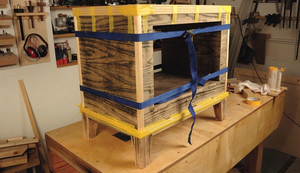 Wooden furniture piece secured with blue straps