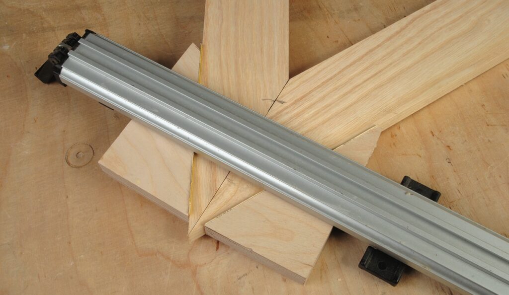 Aluminium square clamped on wooden blocks