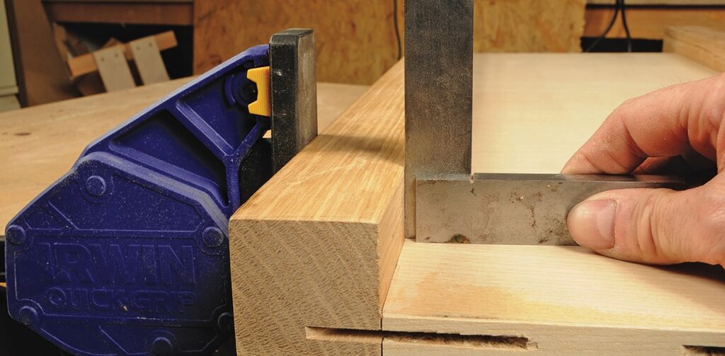 Using a right angle tool on woodwork project.
