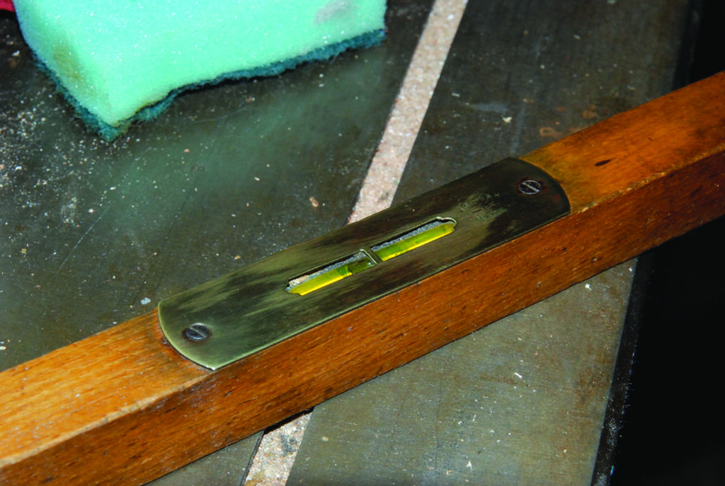 Old spirit level on workshop table