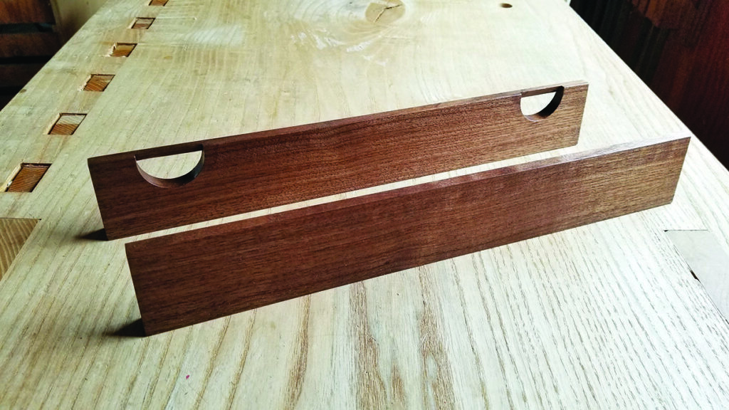 Wooden dovetail marking tools on workbench