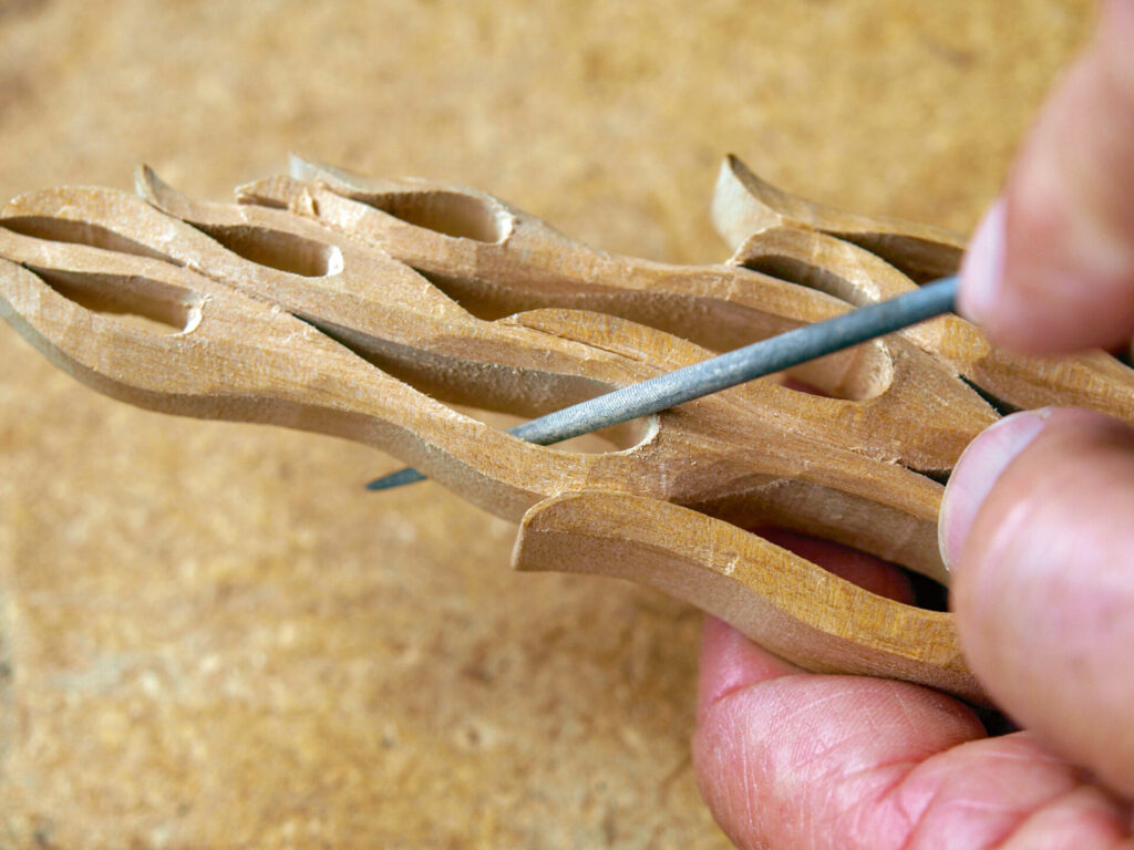Hand carving intricate wooden sculpture detail