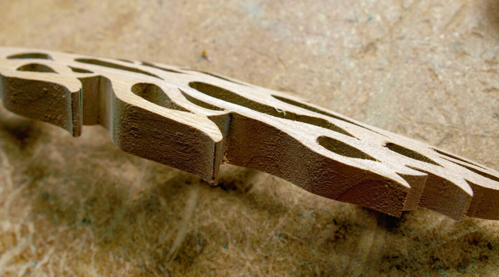 Intricate wooden carving on textured surface
