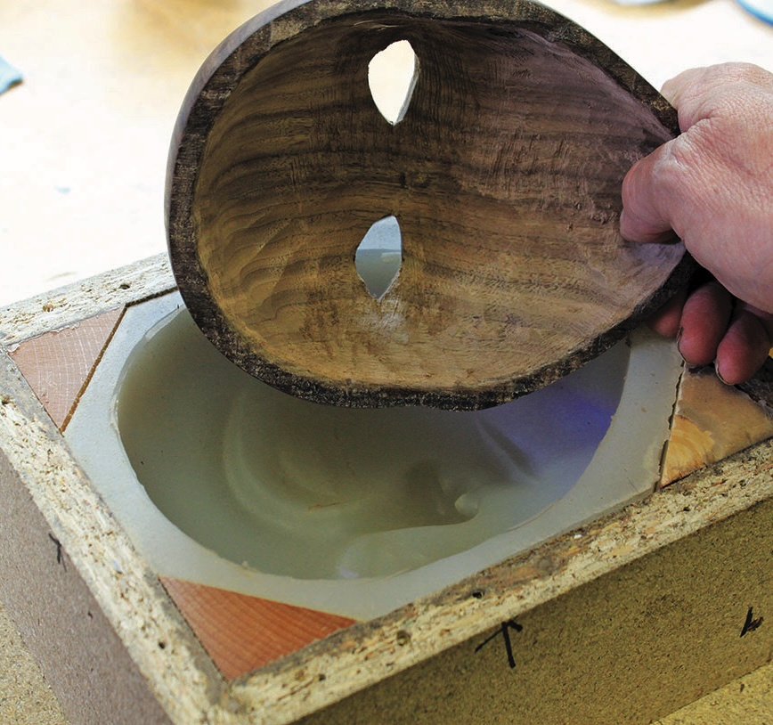Hand crafting wooden bowl with mold