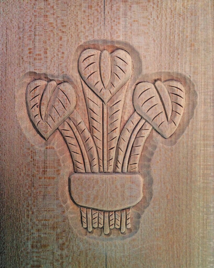 Carved wood panel with leaf design