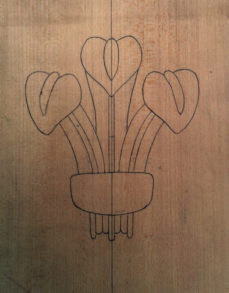 Line drawing of flowers on wood background.