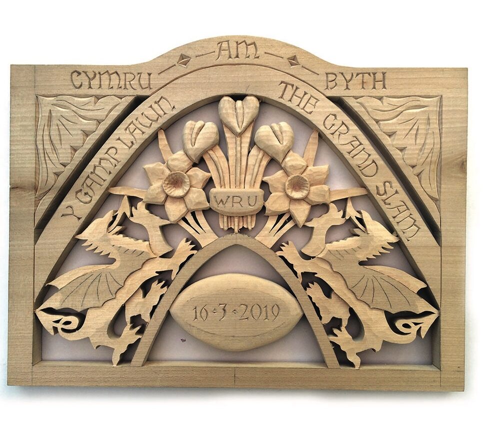 Carved wooden plaque celebrating Welsh rugby Grand Slam.