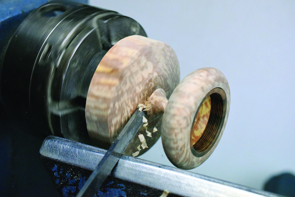Wood turning on a lathe in action