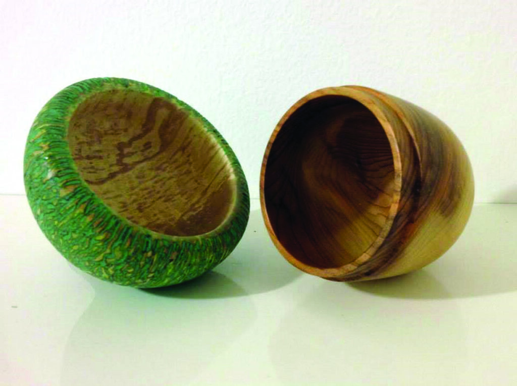 Two handcrafted wooden bowls on display
