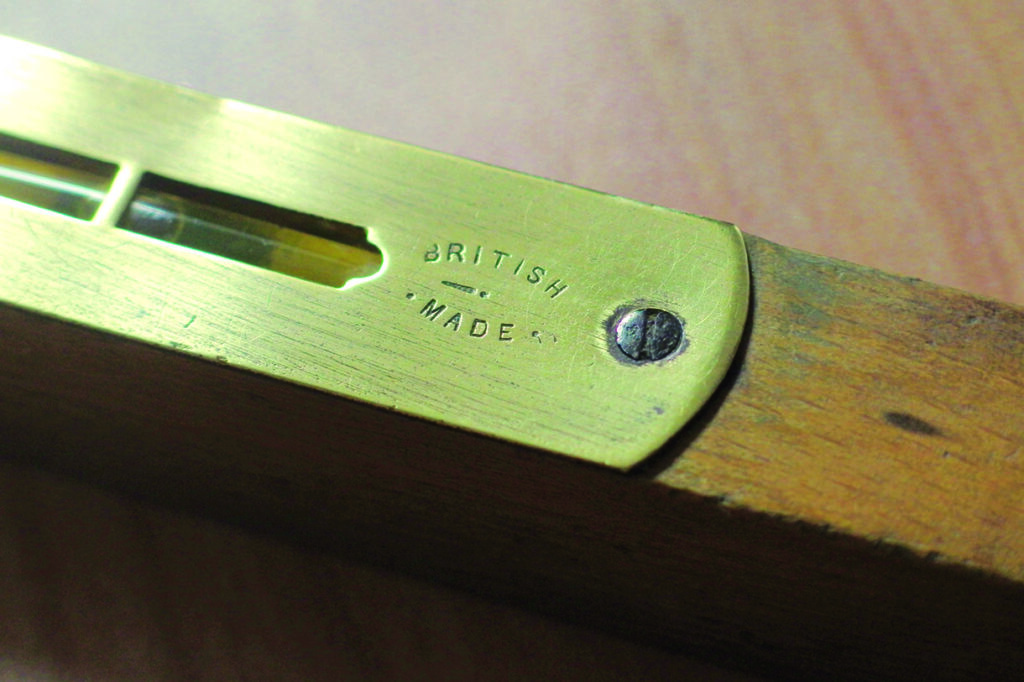 Close-up of British made spirit level tool.