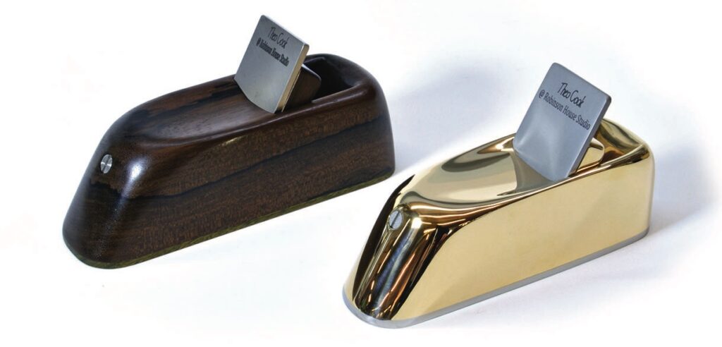 Wood and gold metal block planes with steel blades.