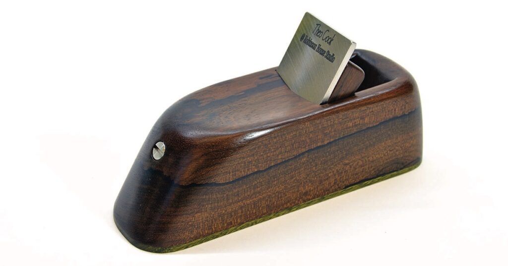 Wooden block plane with steel blade.