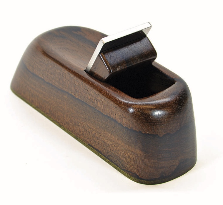 Woodworking hand plane with metal blade.