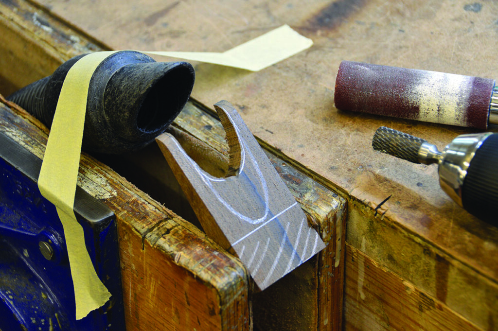 Woodworking table with tools and materials.
