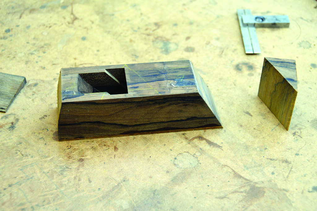 Wooden miter box on a workshop bench