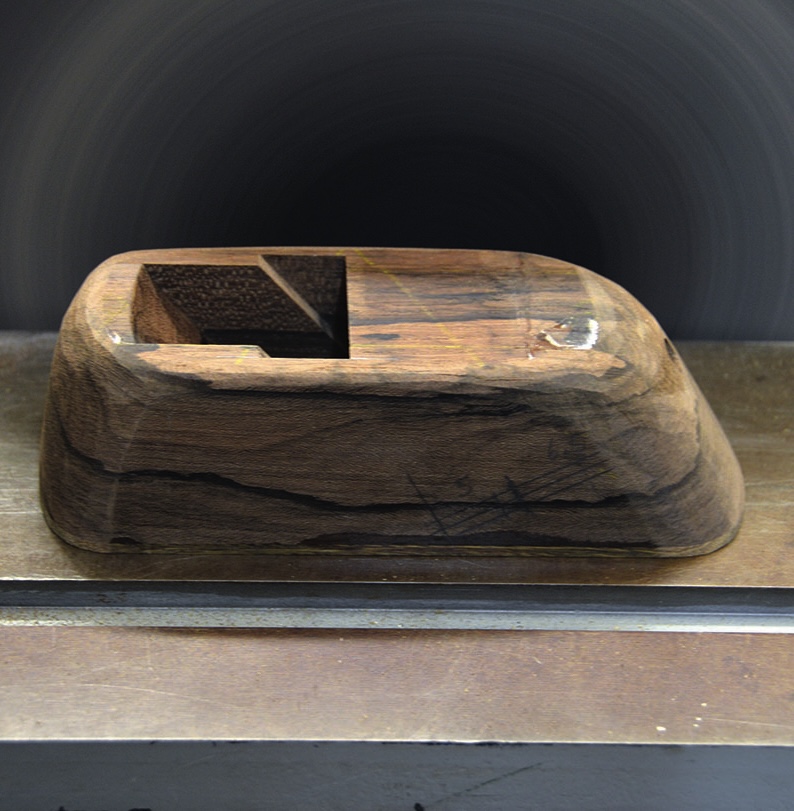 Wooden block sculpture on display surface
