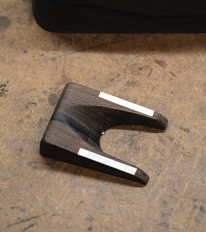 Wooden tool on a workbench.
