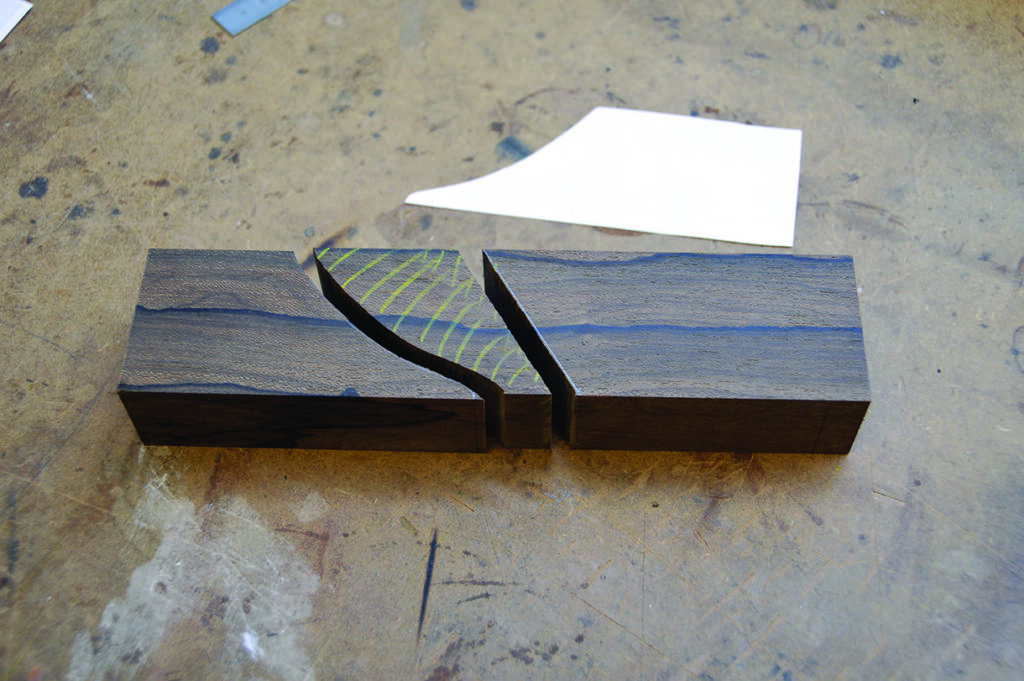 Carved wooden blocks on workshop table