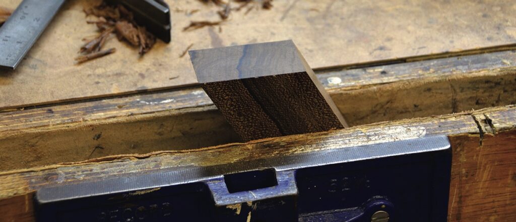 Wooden piece in woodworking bench vise