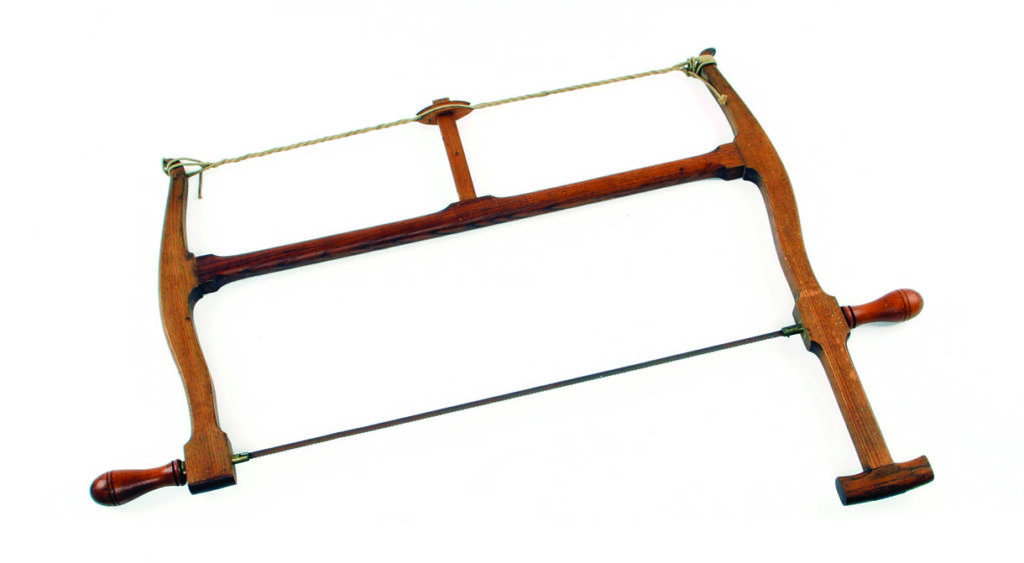 Antique wooden frame saw with tensioning cord