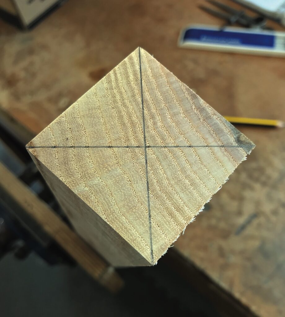 Wood block marked for centre alignment.
