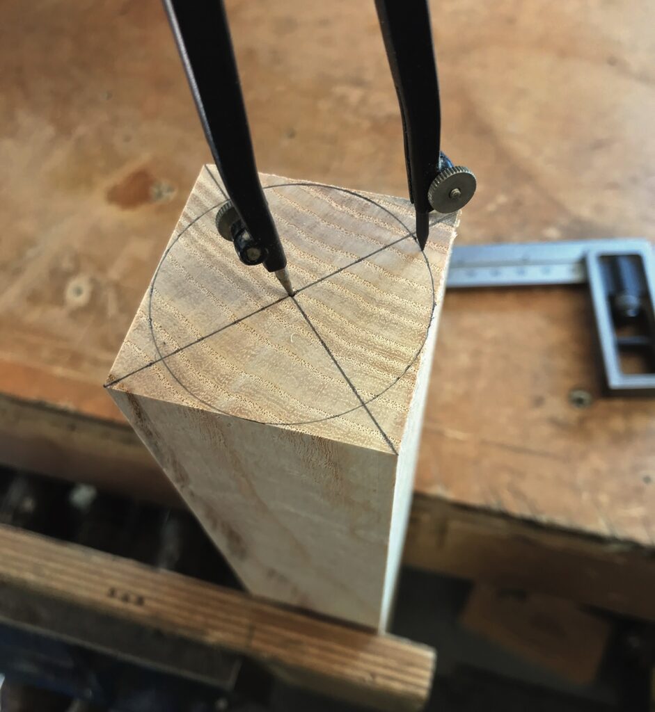 Woodwork compass marking circle on wooden block.