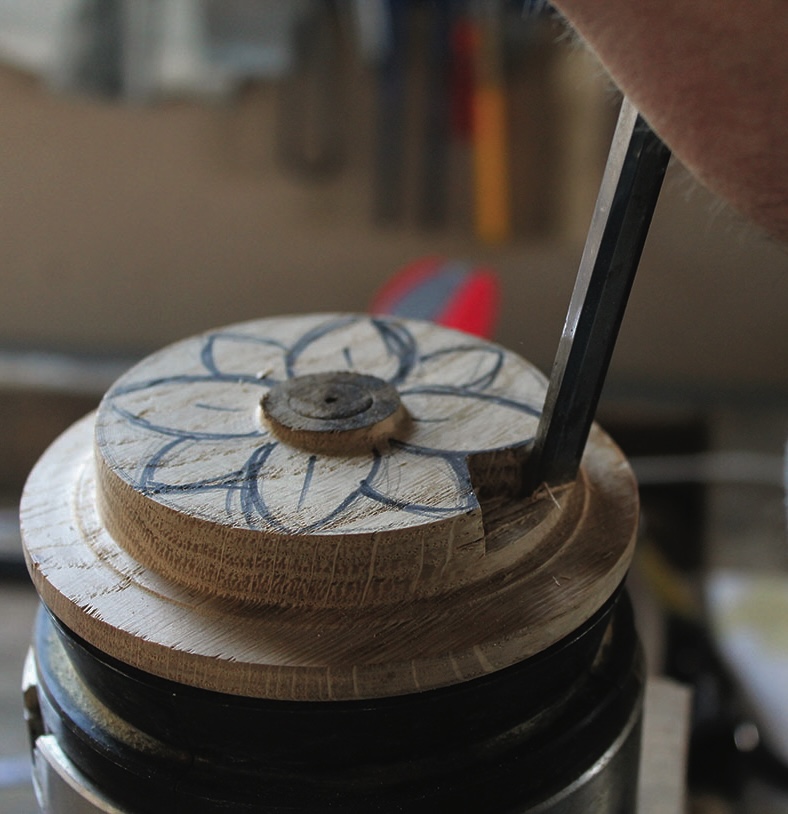 Wood carving with flower design in progress